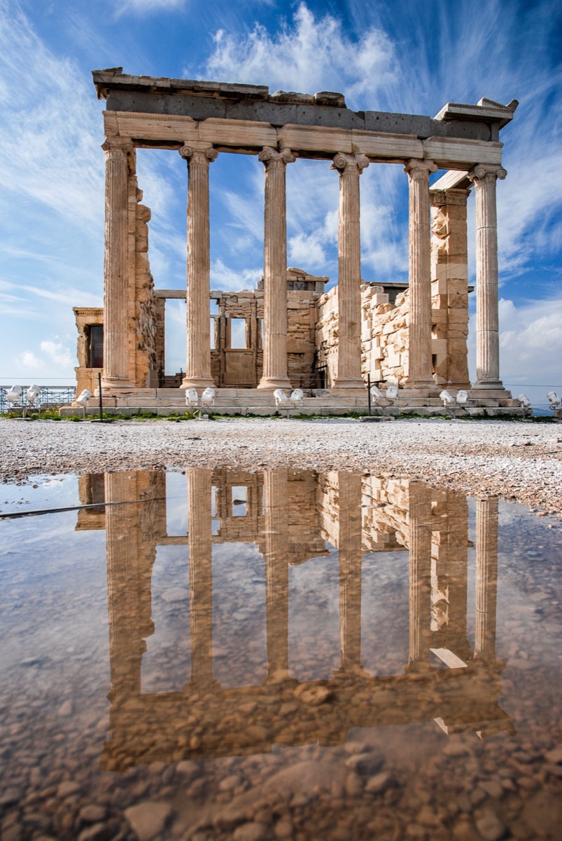The Erechtheion reflected in a puddle on the Acropolis